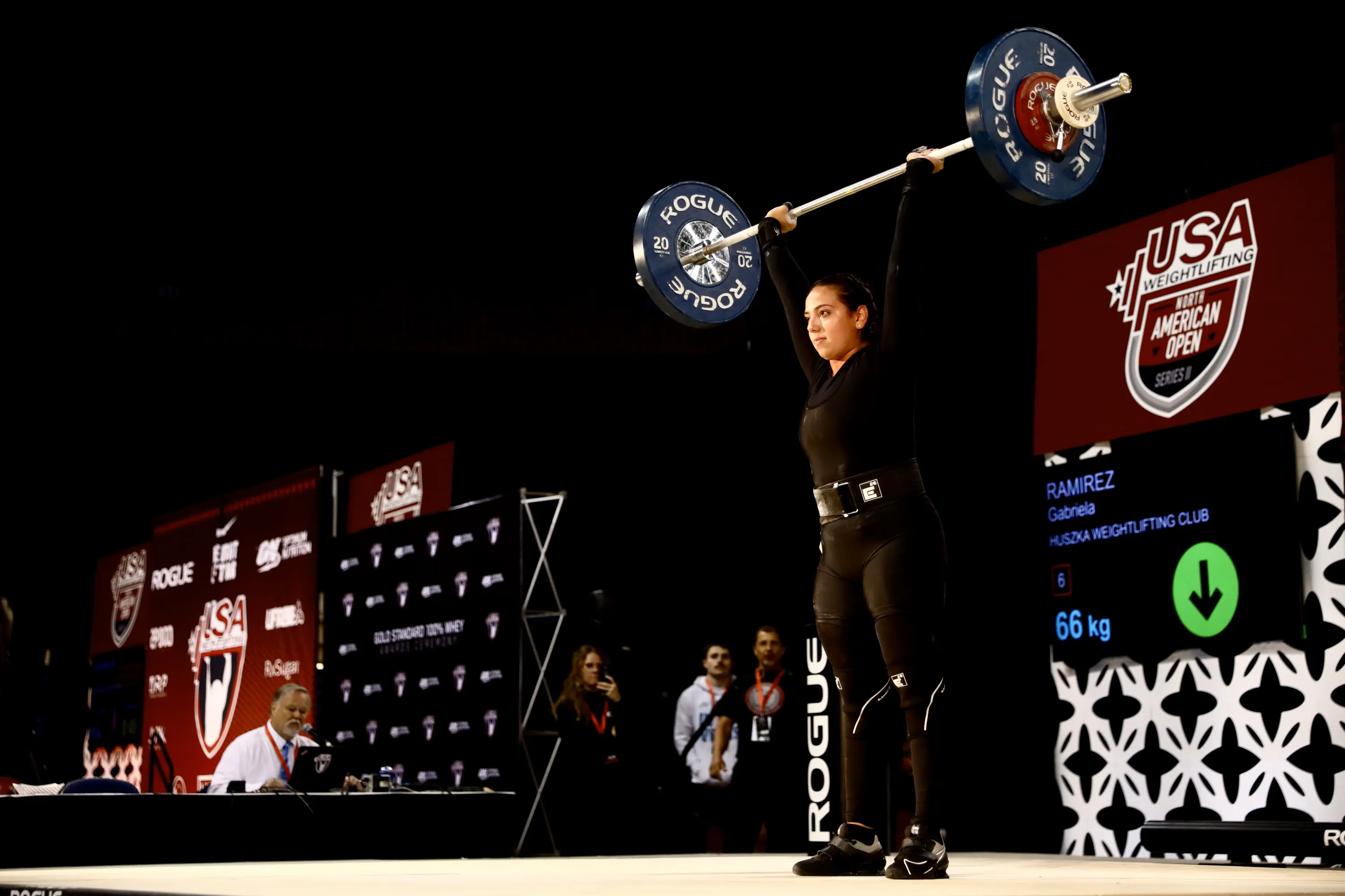 Youth weightlifter performing snatch
