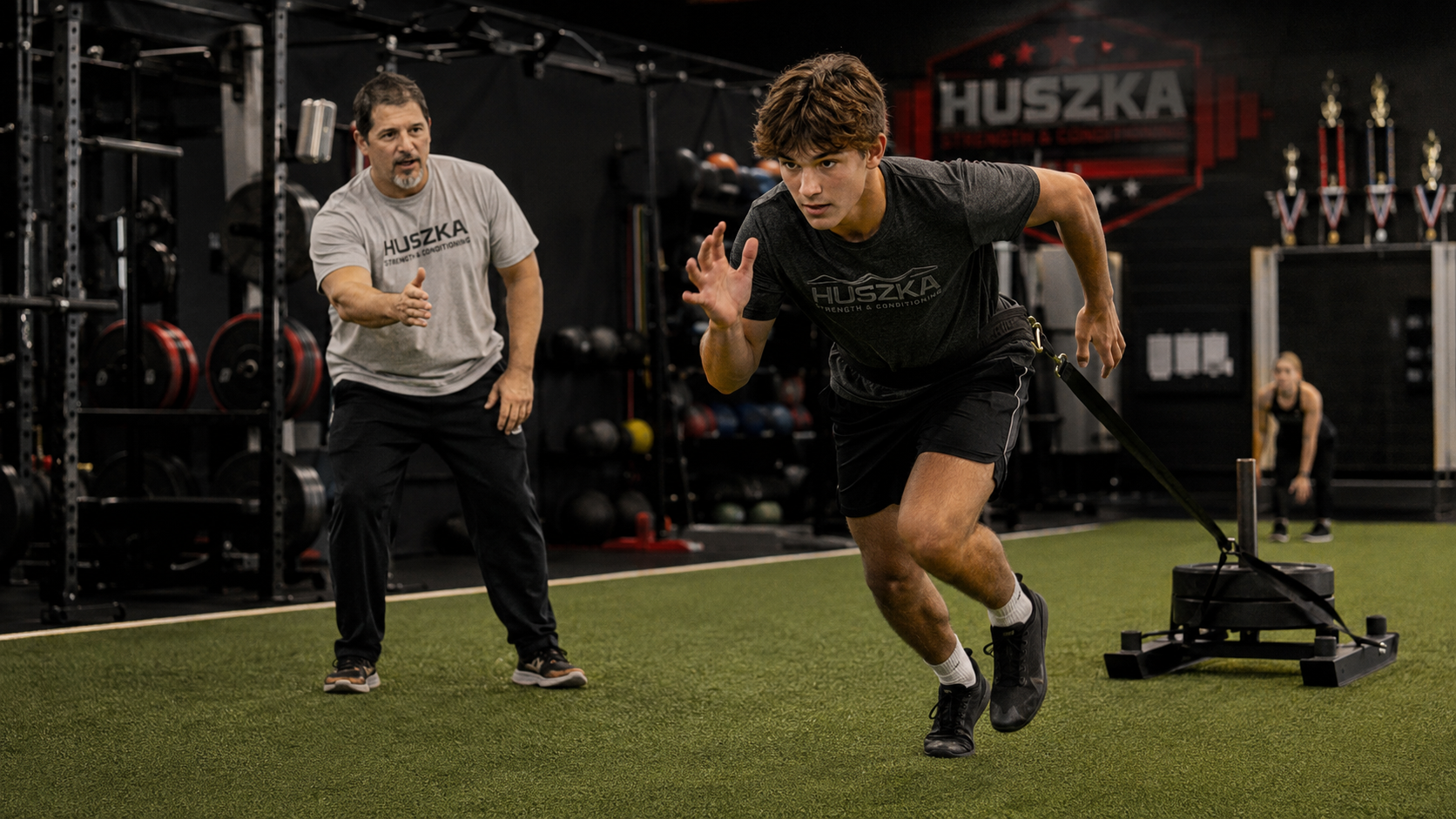 Youth athlete performing resisted sprint training with Coach Attila
